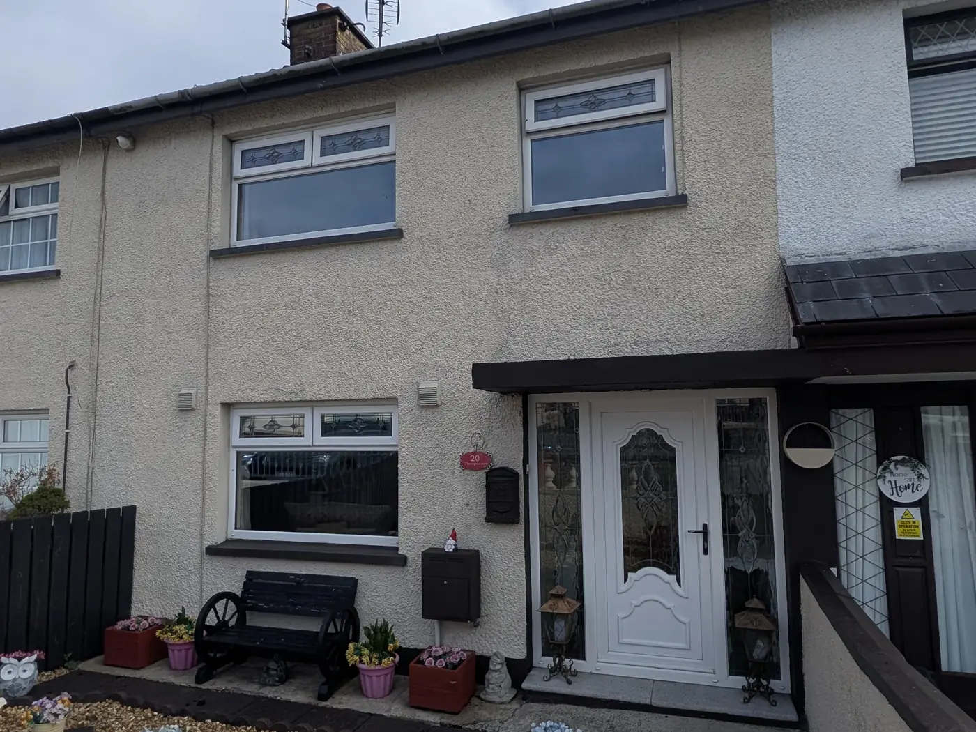 Terraced house front, privacy film before window film installation