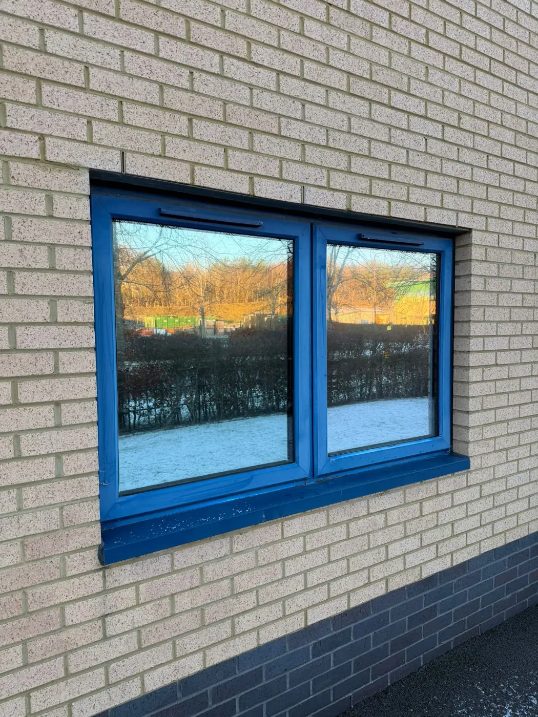 Reflective window film fitted to ground floor office windows
